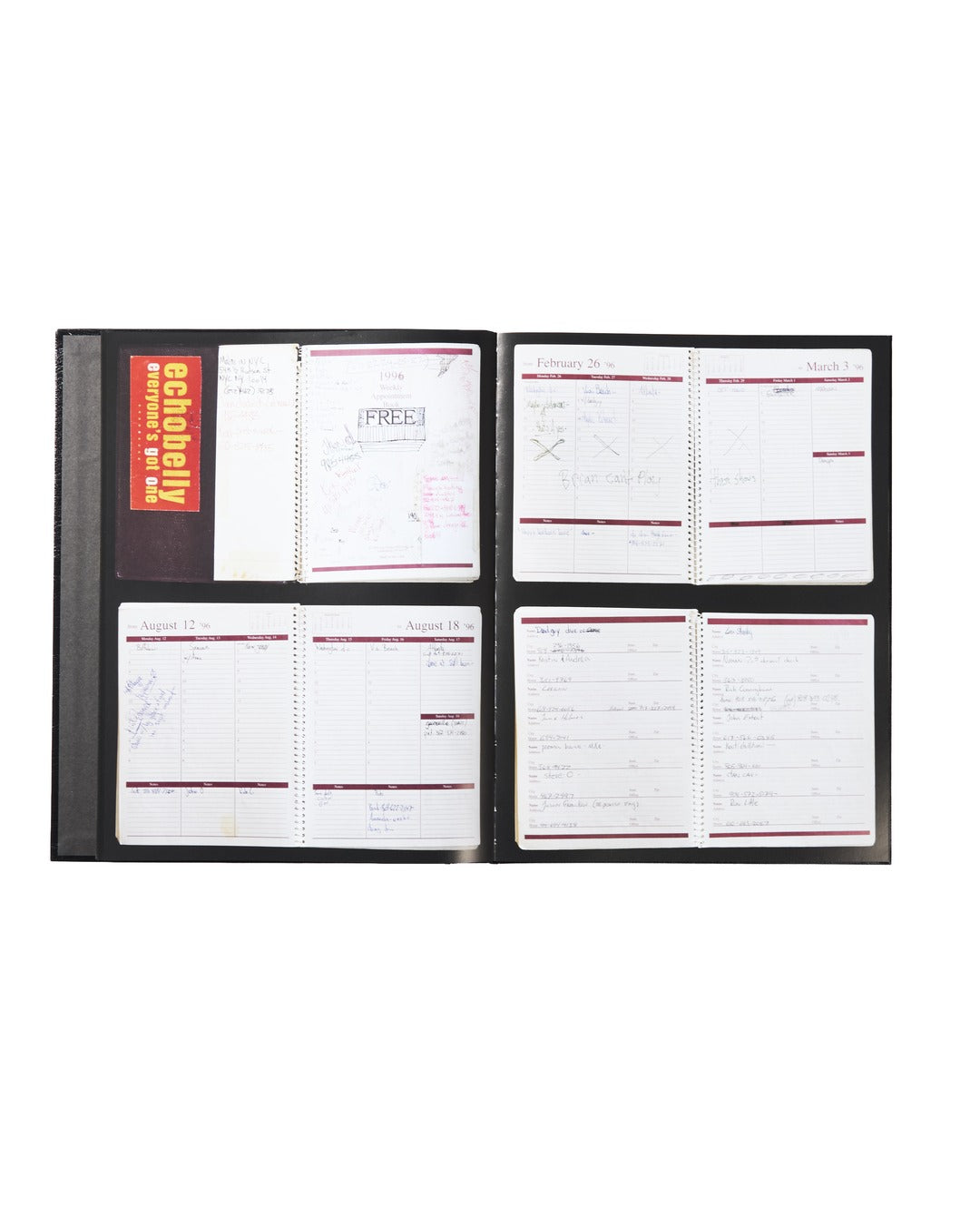 An open black binder from Ink & Dagger displays four pages of handwritten notes and schedules, with an October tab visible on the left, under bright lighting on a white background. This distinctive piece could easily be mistaken for limited edition music memorabilia—something worthy of The Almighty Jeremy Dean Erik Bader or even a collector’s Ink & Dagger book.