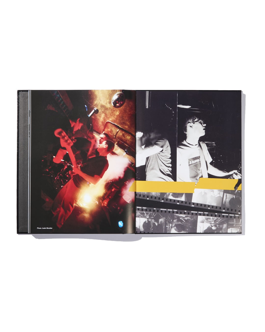 Open book displaying a dramatic double-page spread: the left page presents a vivid color photo of The Almighty Jeremy Dean Erik Bader band performing under striking lighting, while the right page showcases black-and-white shots of a guitarist, enhanced with bold yellow and gray geometric overlays—a stunning feature from the Ink & Dagger limited edition hardcover.