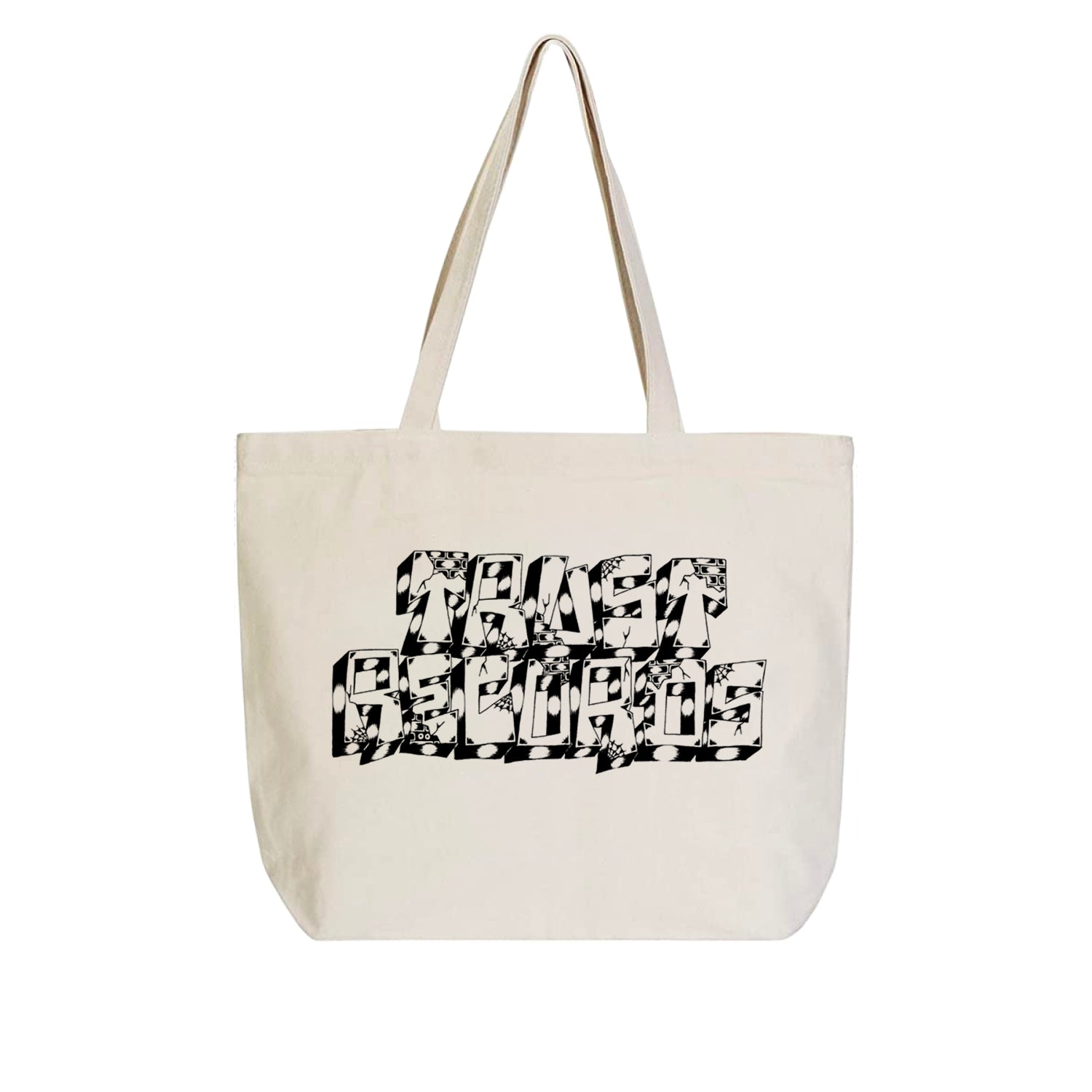 A beige tote bag from Trust Records has two handles and features bold black hand-done "TRUST BELIEVES" lettering by Jesse Barba in a blocky, illustrated style with floral and abstract patterns on the front.