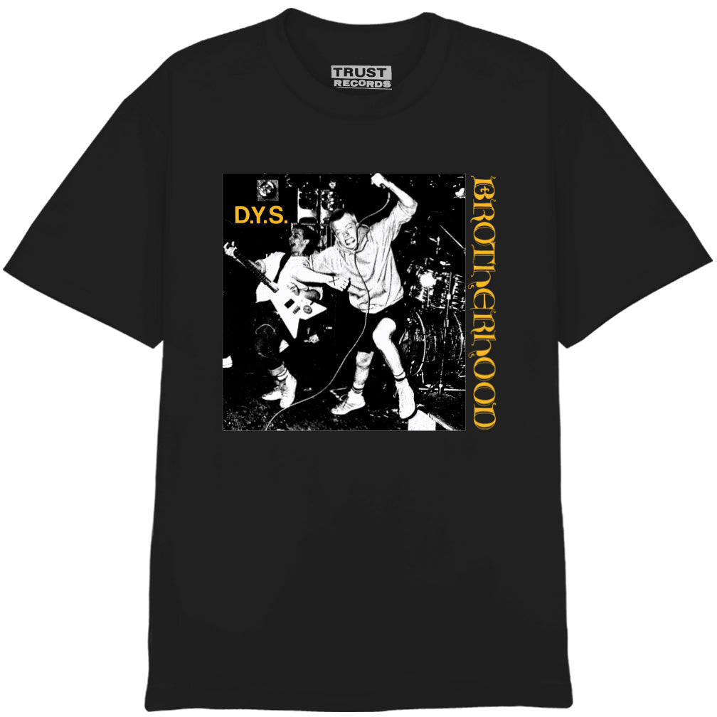 A black D.Y.S. T-shirt with a black-and-white punk band photo, “D.Y.S.” in yellow left, “BROTHERHOOD” vertical right, and TRUST RECORDS inside collar. 100% cotton.