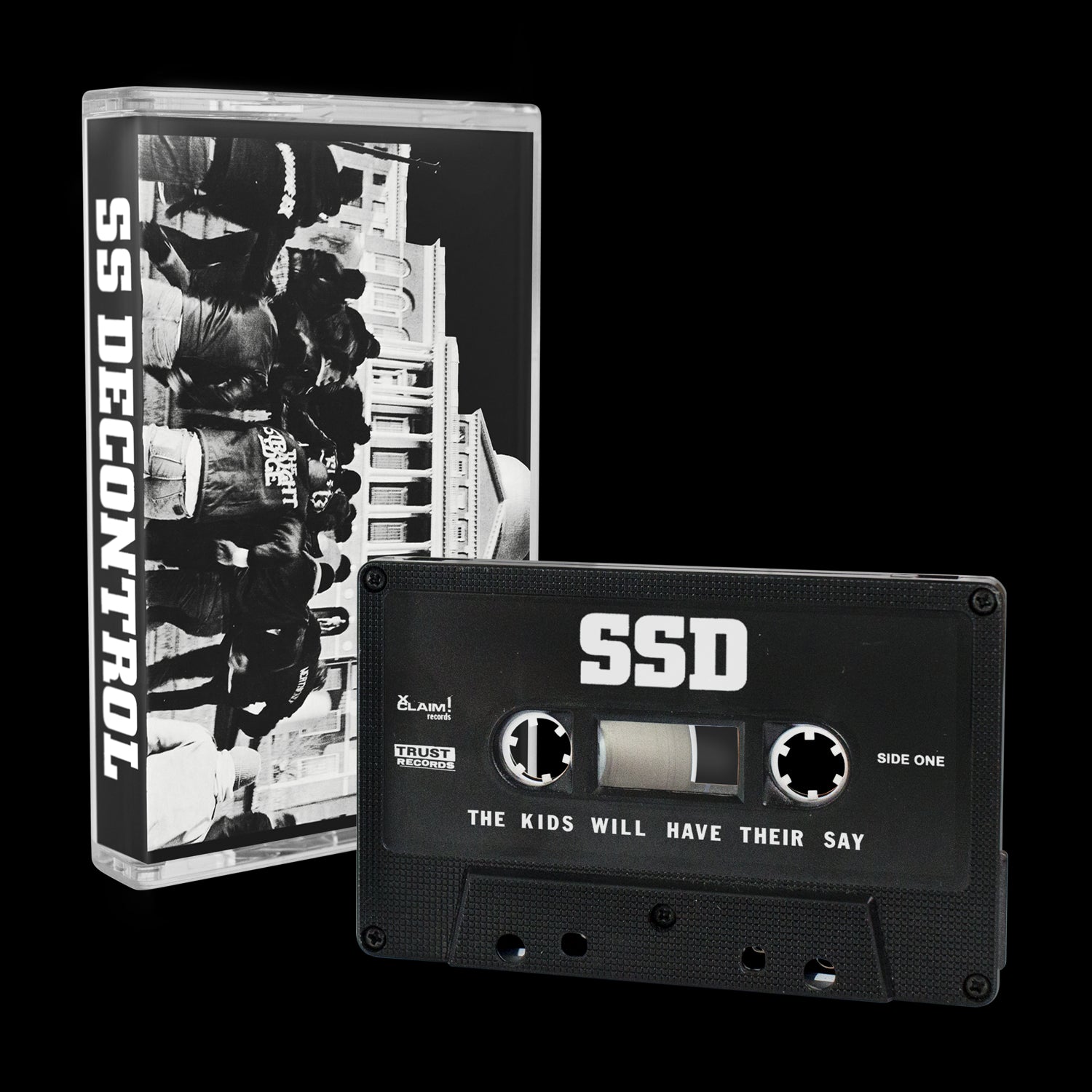 A limited edition The Kids Will Have Their Say cassette by SS Decontrol is pictured in front of its case, which displays a black-and-white group photo and the SS Decontrol name on the spine.
