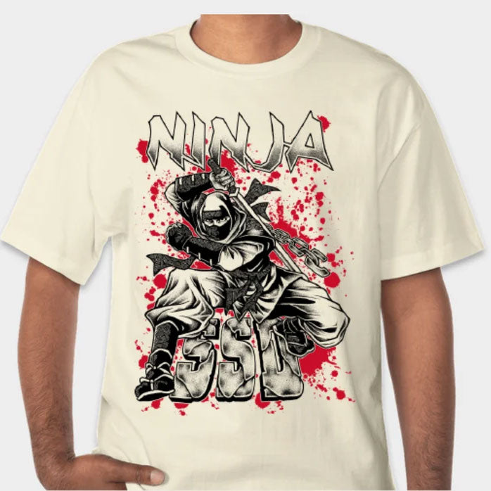 A person wears an SS Decontrol Limited Edition white T-shirt with a masked ninja graphic, dynamic pose, red splatters, and NINJA above bold Japanese characters—a true Ninja Tribute Shirt.