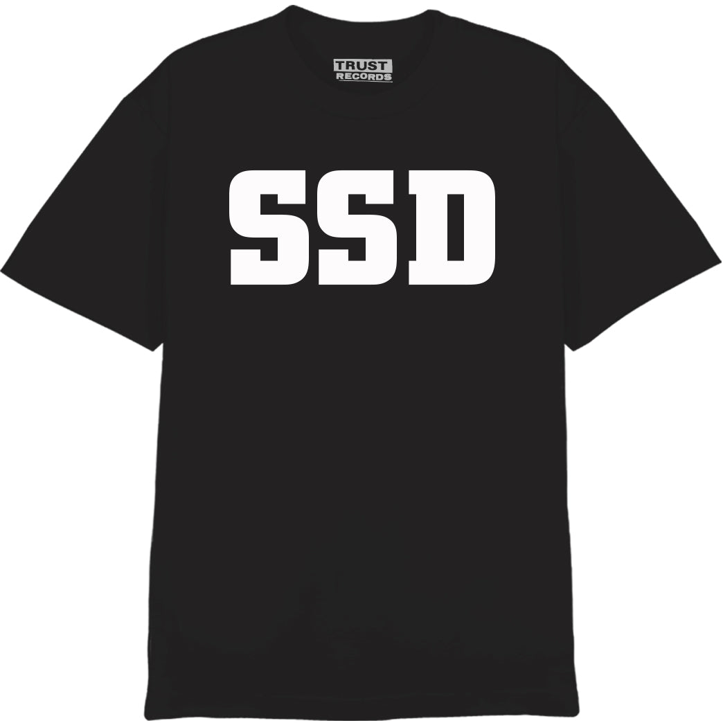 A black SS Decontrol T-shirt featuring a large white SSD logo silkscreened on the front, with a TRUST RECORDS label inside the collar.