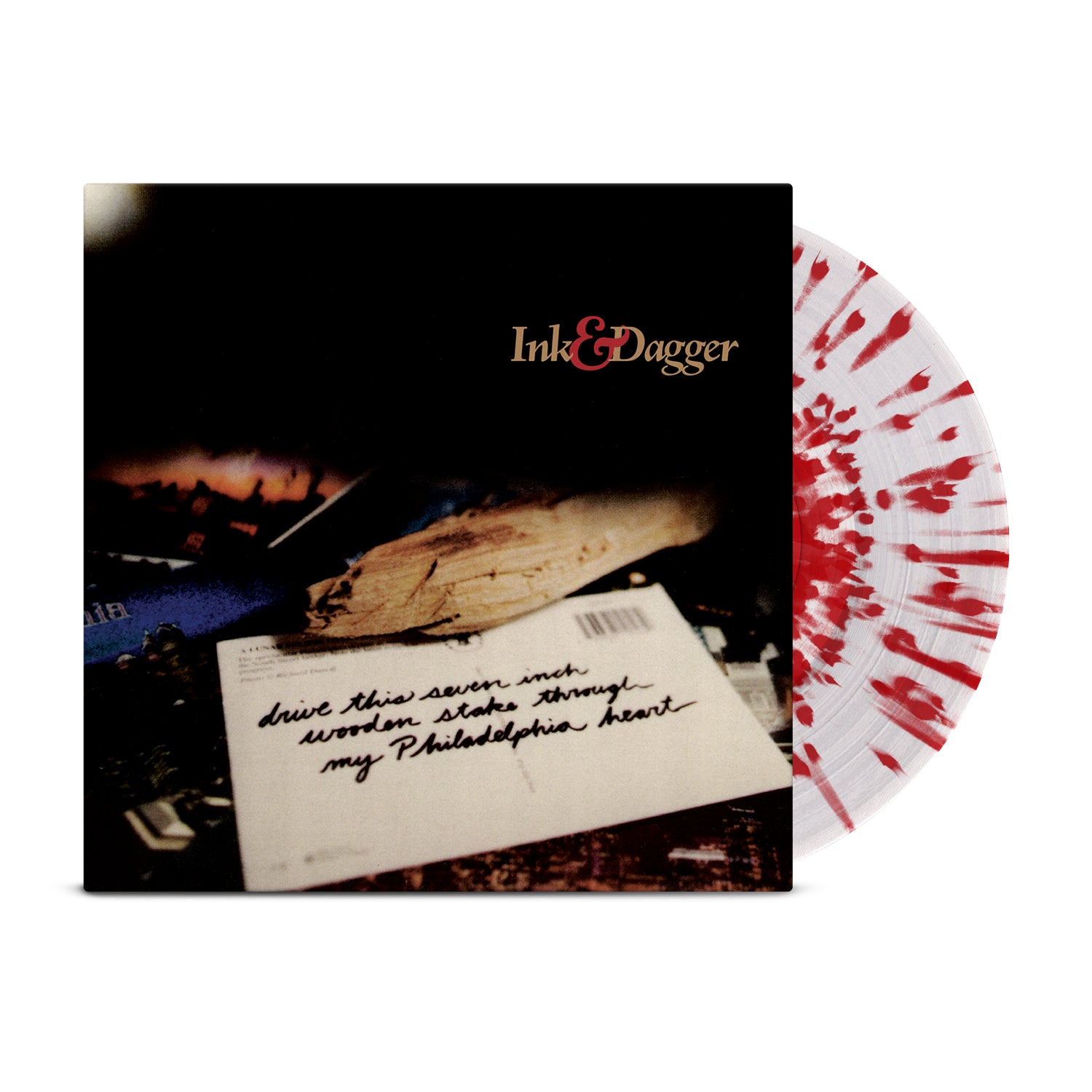 A clear vinyl with red splatter, partly in its cover, displays the Ink & Dagger brand and a handwritten note: Drive This Seven Inch Wooden Stake Through My Philadelphia Heart.