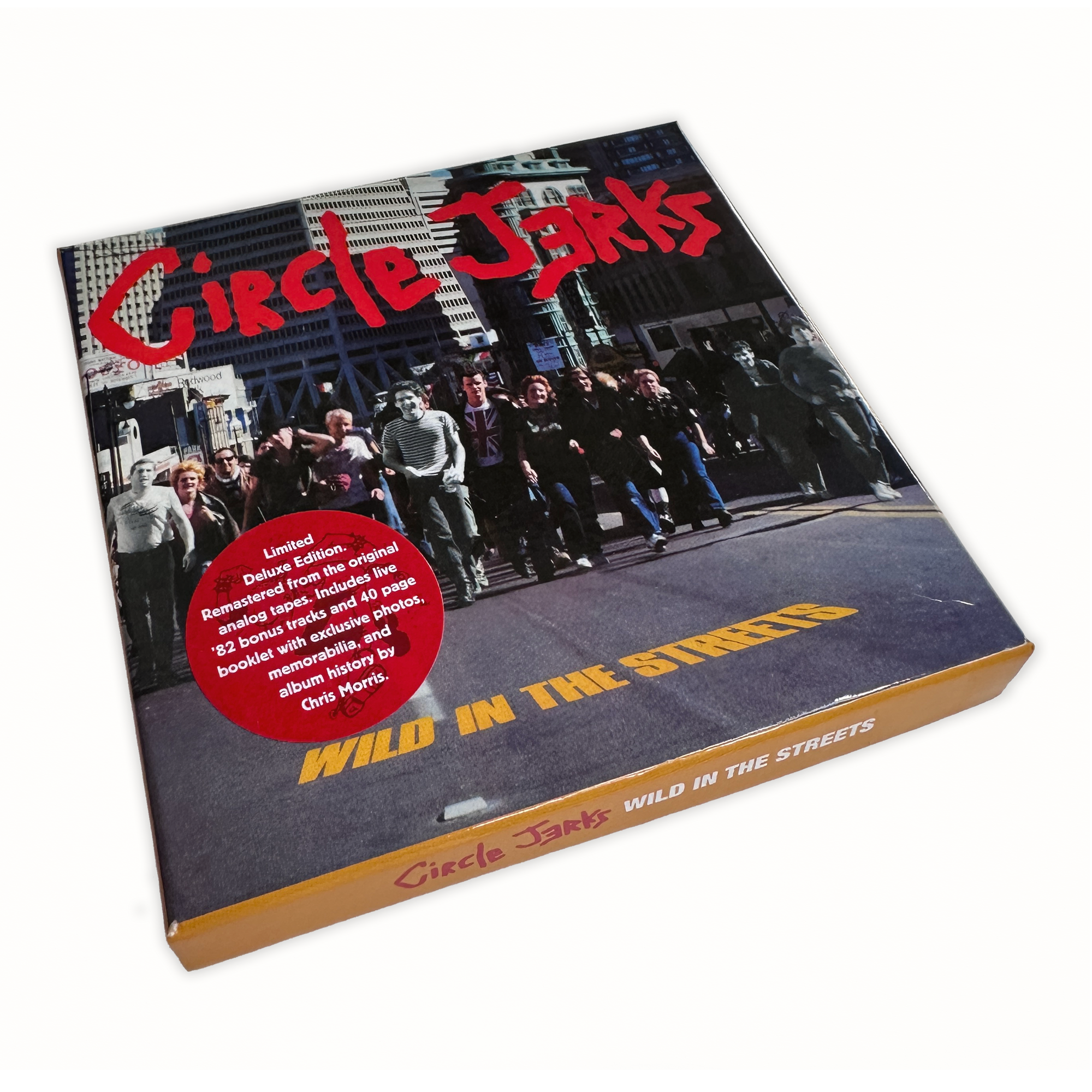 The Circle Jerks Wild In The Streets Deluxe Edition box set features a band photo cover, yellow album title, and a red sticker highlighting the Anniversary Edition CD plus other limited deluxe edition contents.