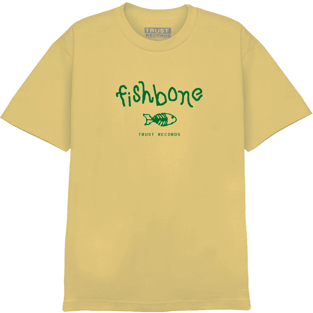 A light yellow Fishbone Comfort Colors T-shirt featuring green Fishbone Logo text above a simple fish illustration, with TRUST RECORDS below. TRUST RECORDS is also printed on the inside collar.