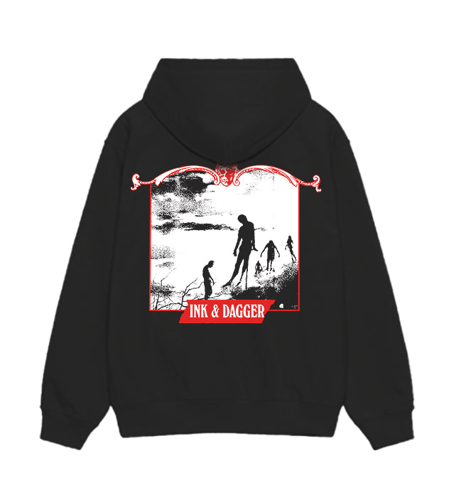 Black hoodie by Ink & Dagger featuring four silhouetted figures on a cloudy background in a red frame, with INK & DAGGER at the bottom—ideal for fans of bold graphic apparel.