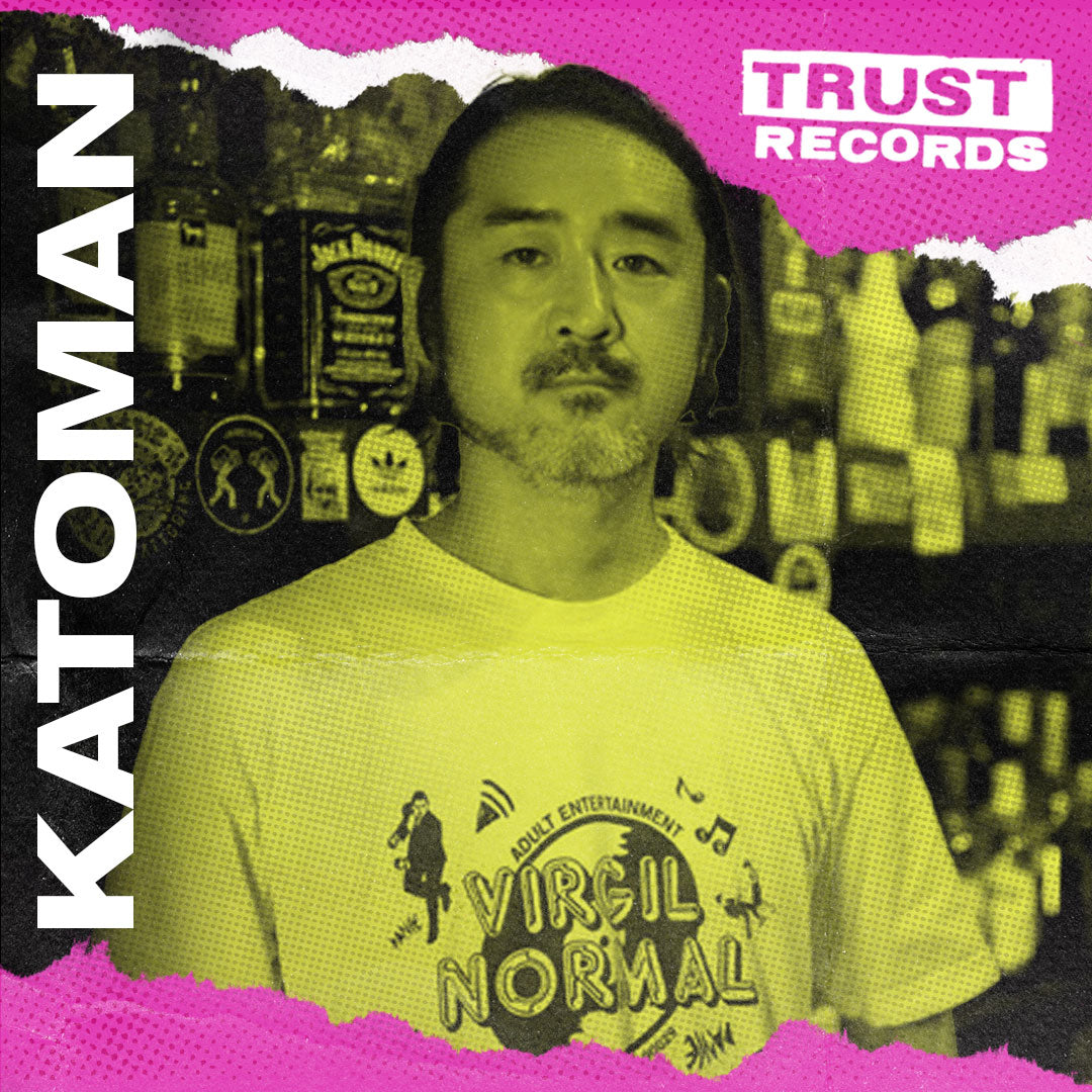 A man with short hair and a beard stands in front of a bar shelf, wearing a Virgil Normal T-shirt. The image features bold text KATOMAN on the left and TRUST RECORDS on a pink banner in the top right corner.