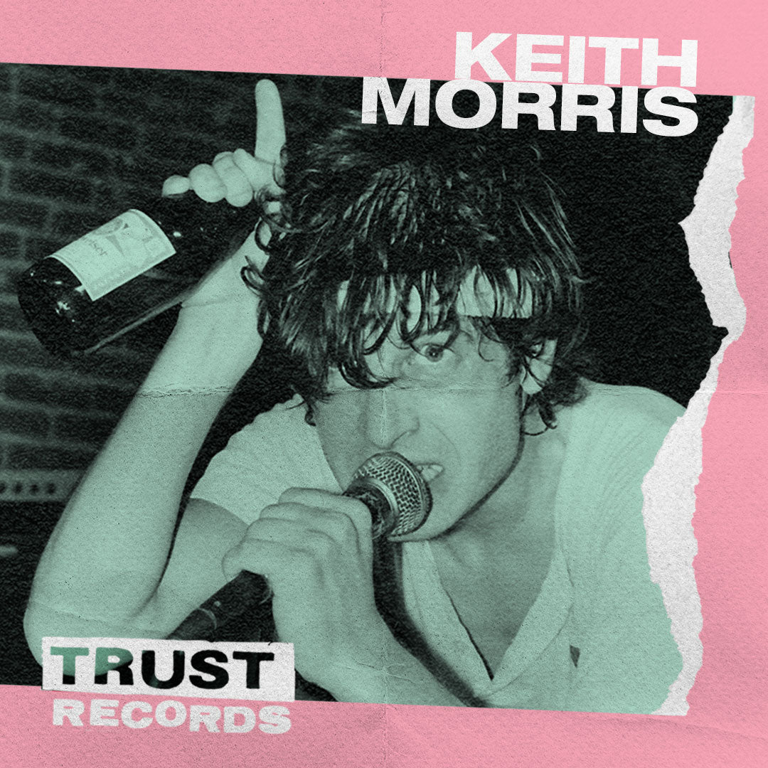A man with wet hair holds a bottle above his head and sings into a microphone. The background is pink with torn paper effects and text that reads KEITH MORRIS and TRUST RECORDS.