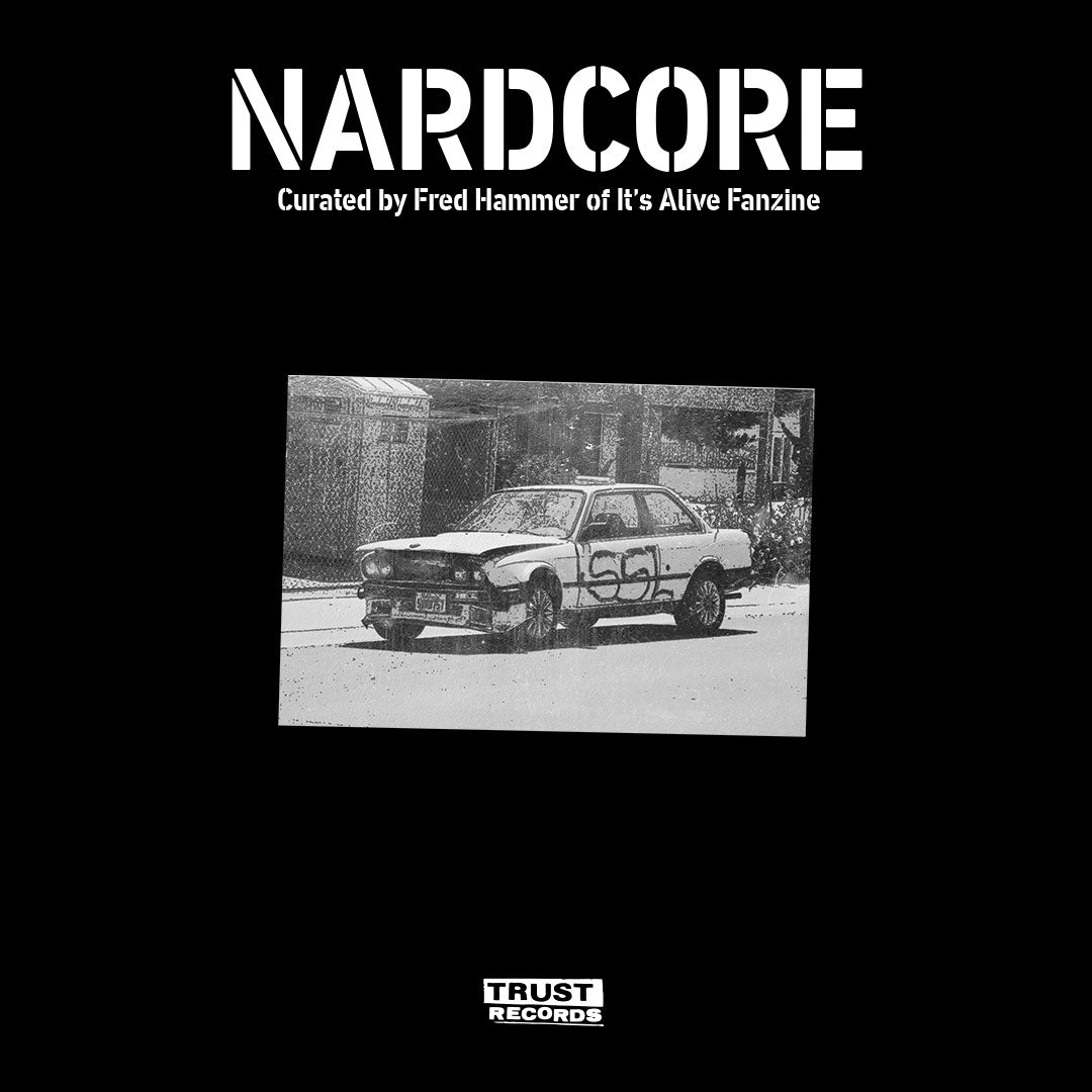 Black and white image of a damaged car with graffiti parked on a street, set against a black background with text reading NARDCORE and Curated by Fred Hammer of Its Alive Fanzine above it, and TRUST RECORDS below.