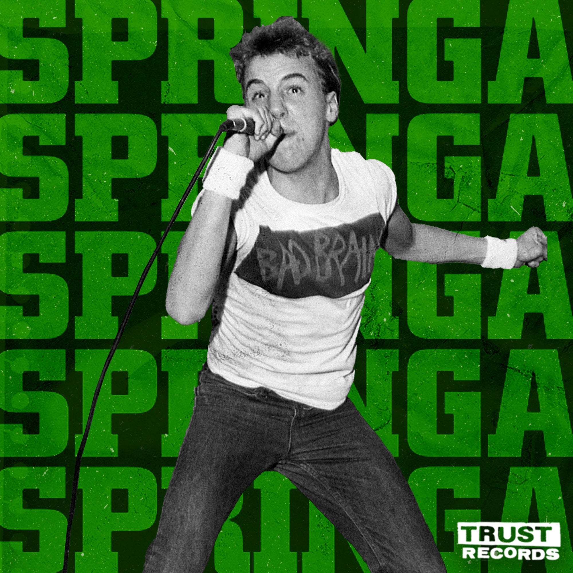 A singer energetically performing with a microphone, wearing a Bad Brains t-shirt, in front of a green background with the repeated word SPRINGA and the Trust Records logo in the corner.