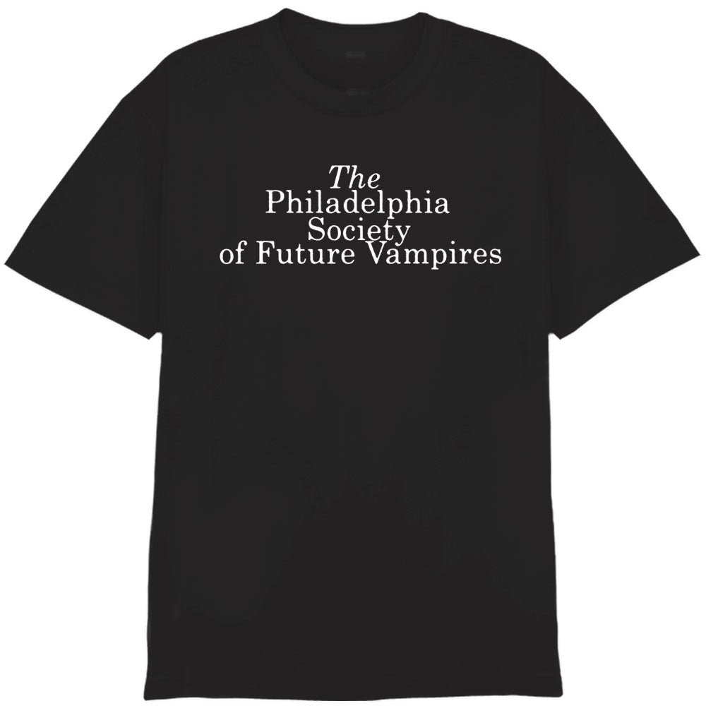 The Ink & Dagger black Comfort Colors T-shirt features "The Philadelphia Society of Future Vampires" in white serif font on the chest. Available for presale; shipping begins 12/12/25.