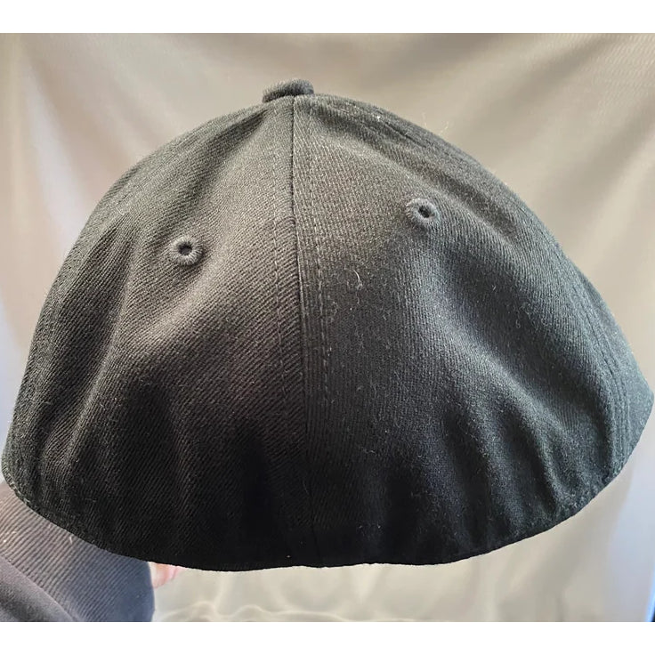 A black six-panel SS Decontrol Flexfit Flat Bill Cap with bold yellow outlined SSD embroidery on the front and a premium fitted 210 Flexfit sticker on the brim.