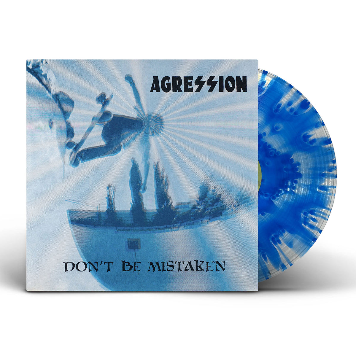 A Clear &amp; Blue Cloudy Variant vinyl by Agression partially slides out of its cover, which features a fisheye photo of a skateboarder mid-air. The remastered Don’t Be Mistaken album title and band name appear in bold text.