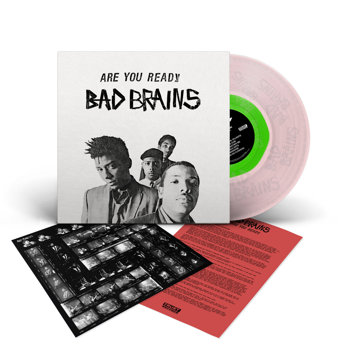 Bad Brains Are You Ready? vinyl set features their first studio recording on a stunning clear vinyl disc. The package includes an album cover showcasing the band members, a black-and-white photo sheet, and a striking red lyric or info sheet displayed in front.