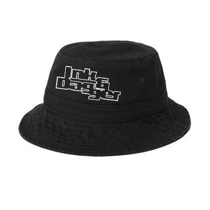 A black bucket hat from Ink & Dagger features bold, white stylized lettering of the brand on the front, creating a striking look against any background.