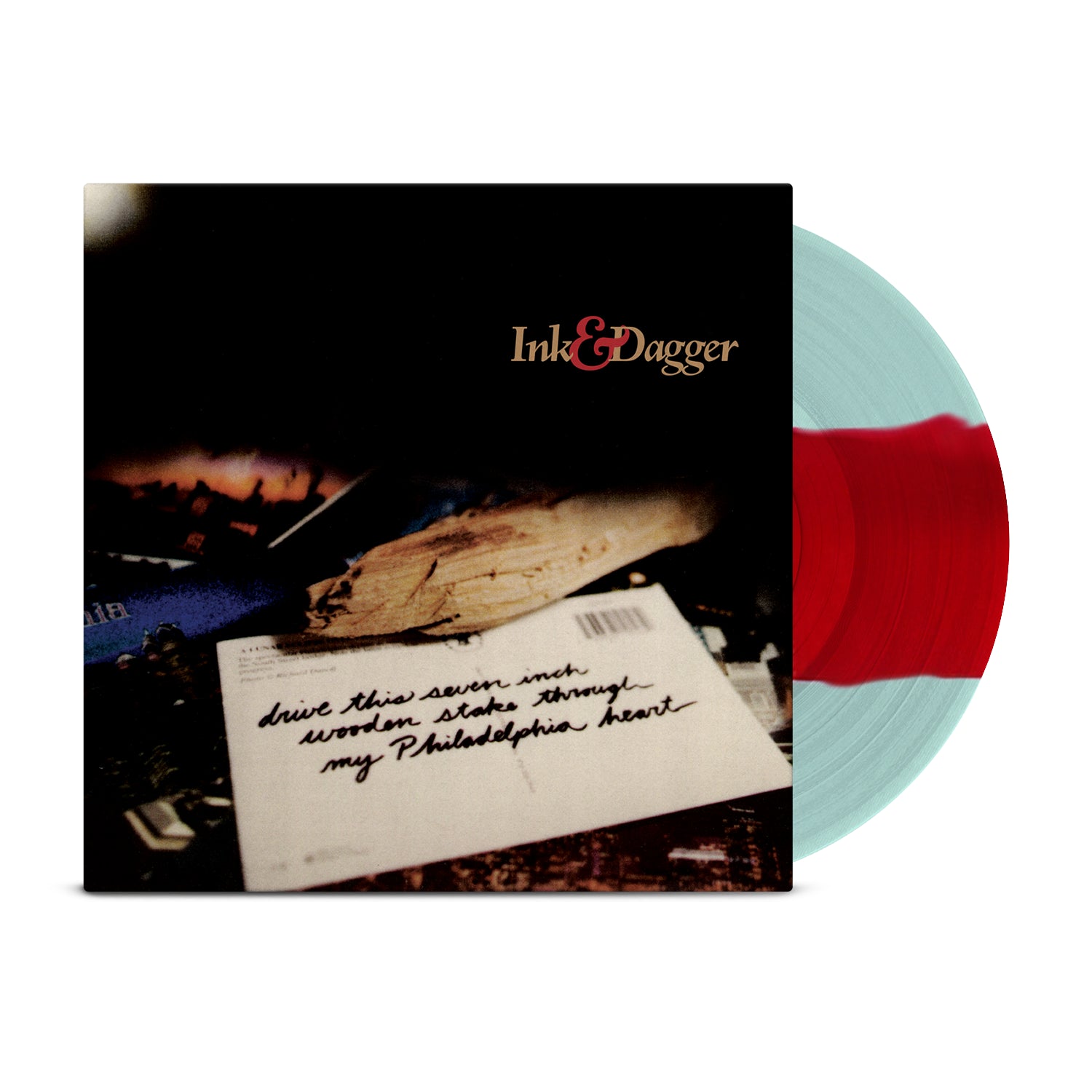 A Coke Bottle Clear & Red Striped Vinyl rests partially in its album sleeve, featuring a blurry photo of a handwritten letter and the Ink & Dagger brand name—a must-have for Ink & Dagger vinyl collectors.
