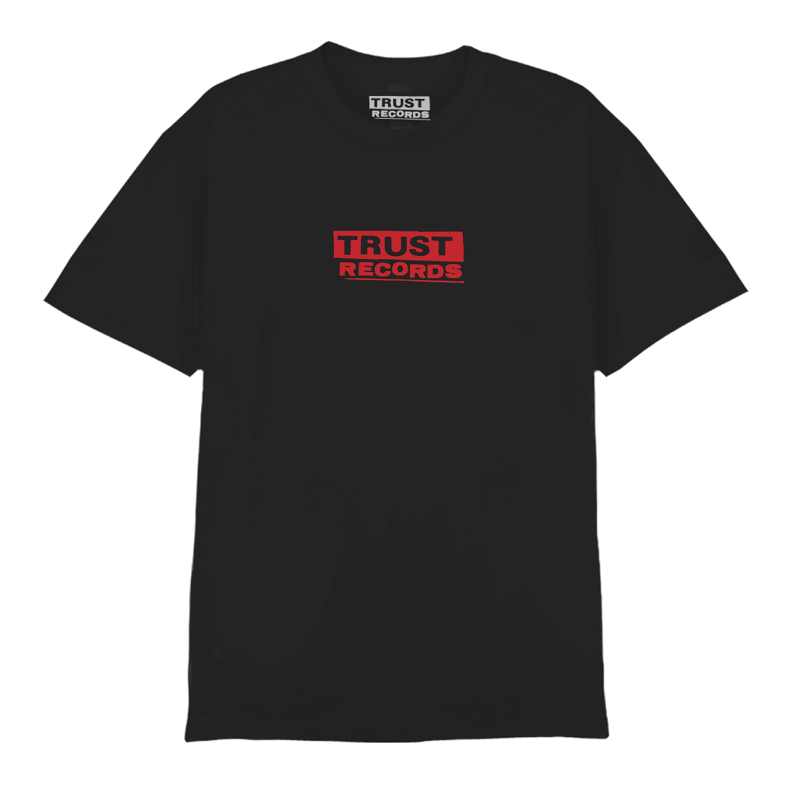 A black Comfort Colors T-shirt from Ink & Dagger features "TRUST RECORDS" in bold red letters by MAG within a red rectangle on the chest, with the same text in white on the inside collar label. Now available for presale.