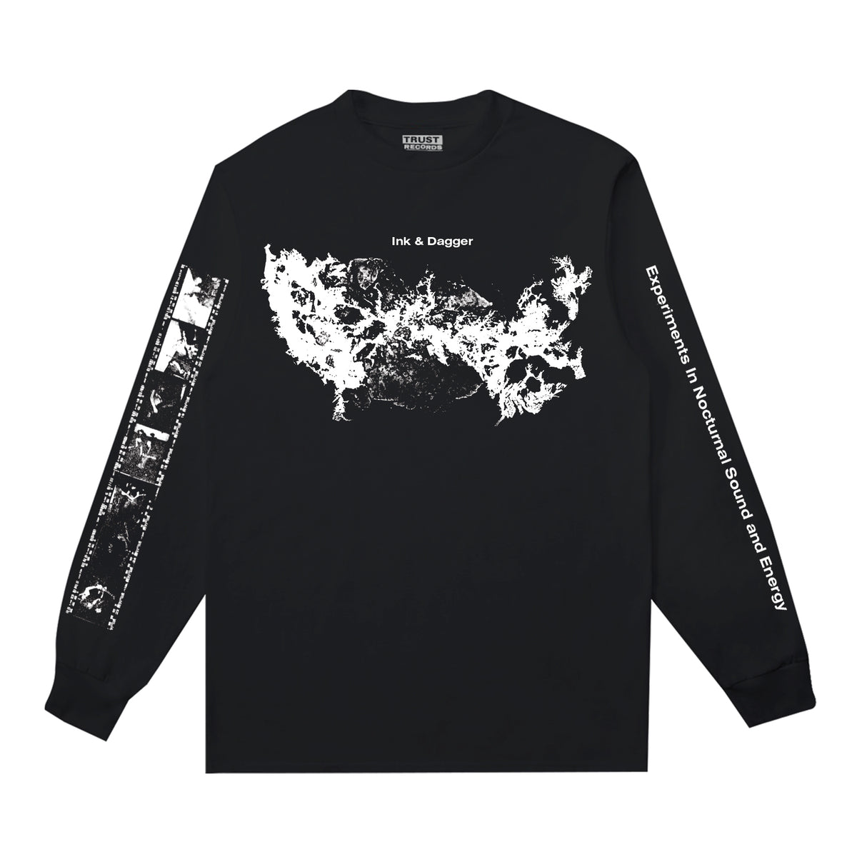 Ink &amp; Dagger black long-sleeve Comfort Colors shirt features an abstract white chest graphic, Ink &amp; Dagger logo above, left sleeve art, and &quot;Experiments in Nocturnal Sound and Energy&quot; down the right sleeve. Limited presale—order now!.