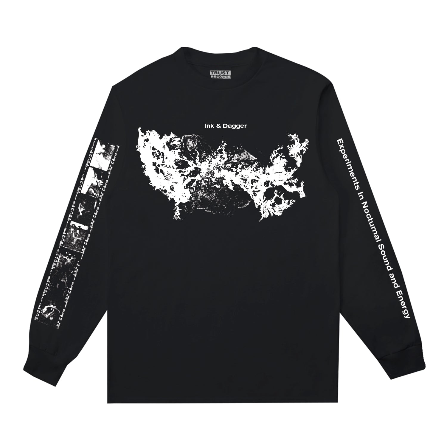 Ink & Dagger black long-sleeve Comfort Colors shirt features an abstract white chest graphic, Ink & Dagger logo above, left sleeve art, and "Experiments in Nocturnal Sound and Energy" down the right sleeve. Limited presale—order now!.