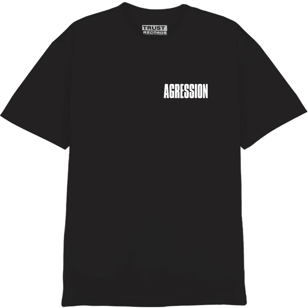 The black Agression Alstyle 1301 tee features a white AGRESSION print on the front left chest. The back sports large AGRESSION text with a cracked design, lightning bolt, extra wording, and “DONT BE MISTAKEN” at the bottom. 100% cotton.