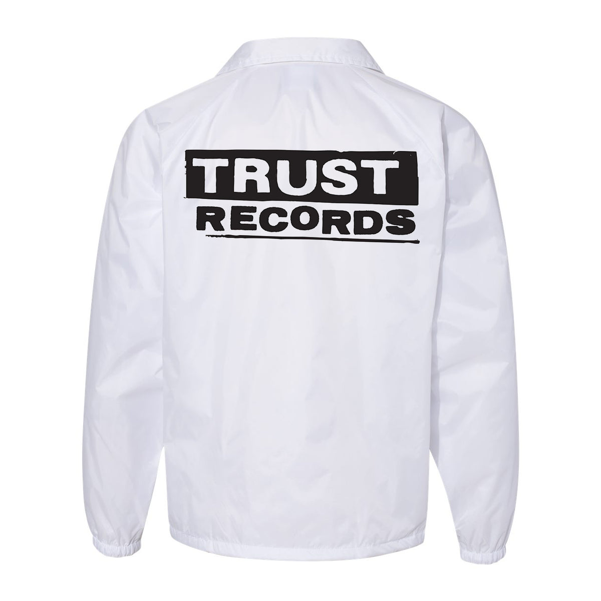 A white Trust Records windbreaker, shown from the back, features bold black TRUST RECORDS text across the upper back—ideal for fans of the iconic brand's classic jacket style.