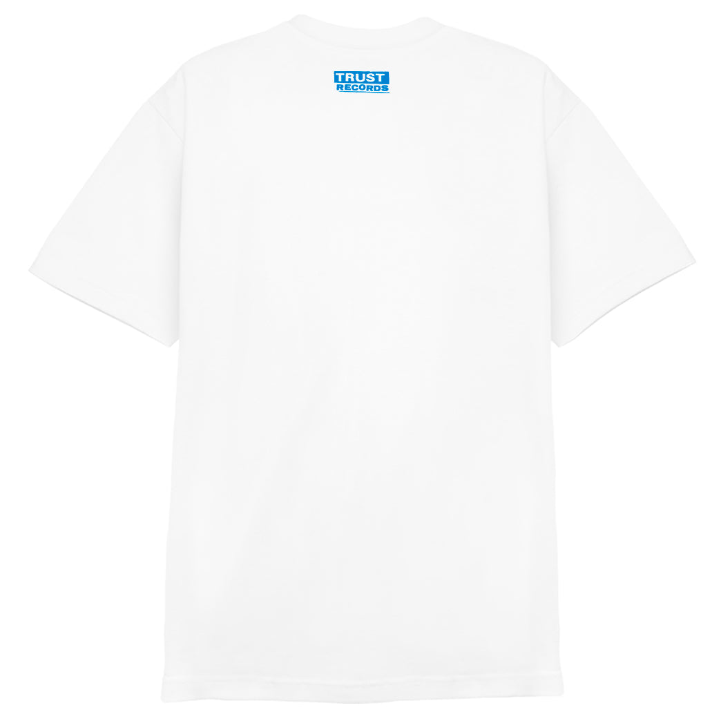 White t-shirt from 7 Seconds, made of 100% cotton Alstyle 1301, with “7SECONDS” silkscreened seven times in bold blue all-caps letters stacked vertically on the front.