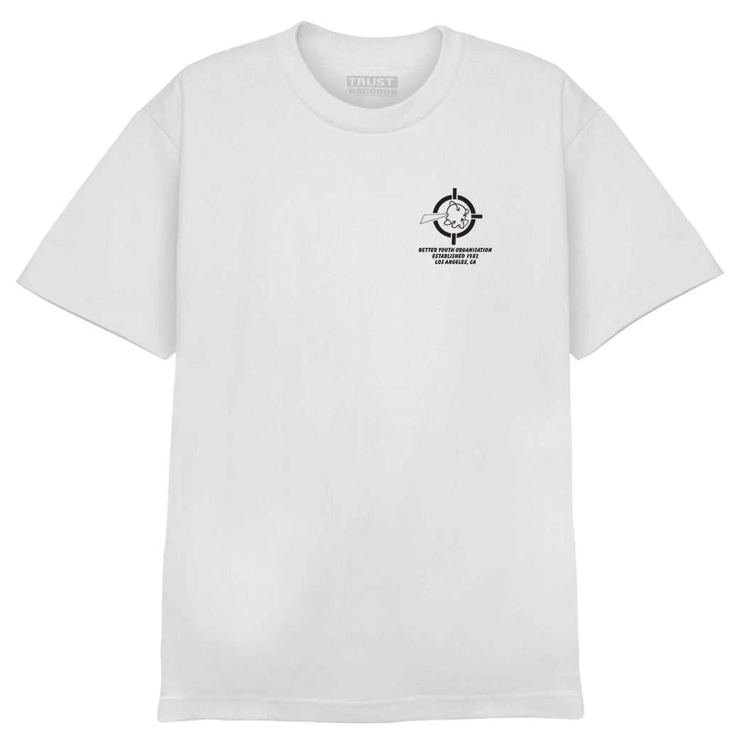 A plain white Alstyle 1301 cotton T-shirt by Better Youth Organization features a small black silkscreen graphic on the left chest: a target with a heart in the center, and the text Better Youth Organization, ESTMMXXIII below.