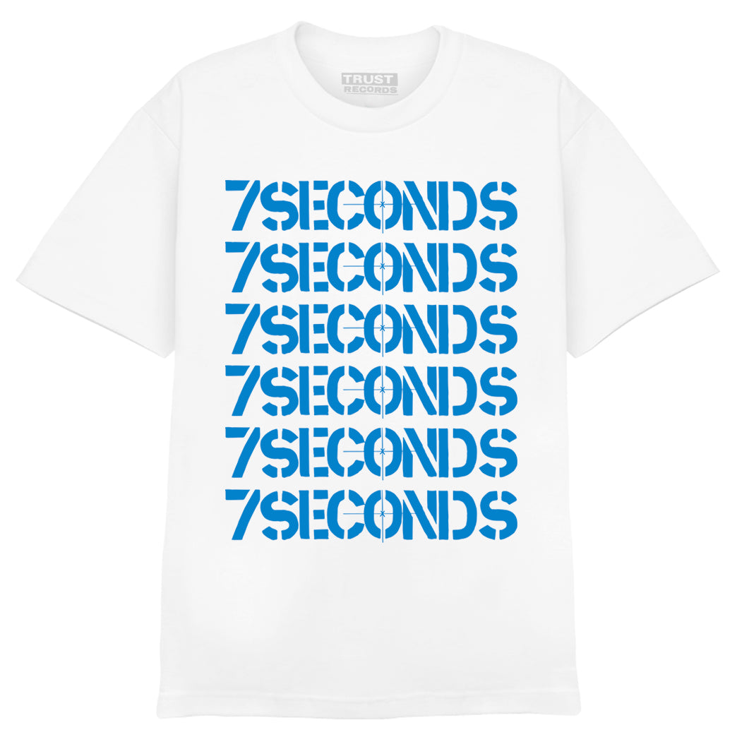 White t-shirt from 7 Seconds, made of 100% cotton Alstyle 1301, with “7SECONDS” silkscreened seven times in bold blue all-caps letters stacked vertically on the front.